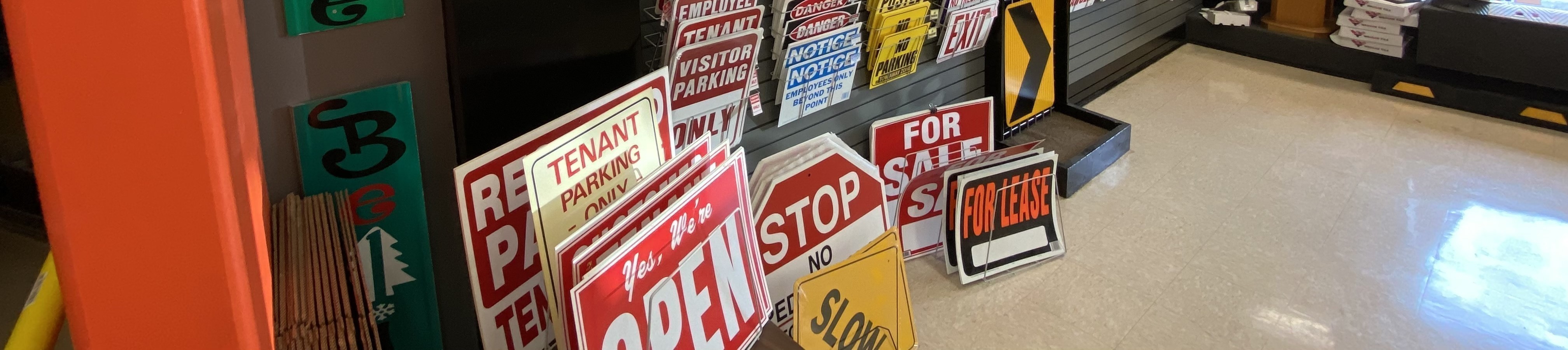 Various building signs organized by type inside the groundUP stores