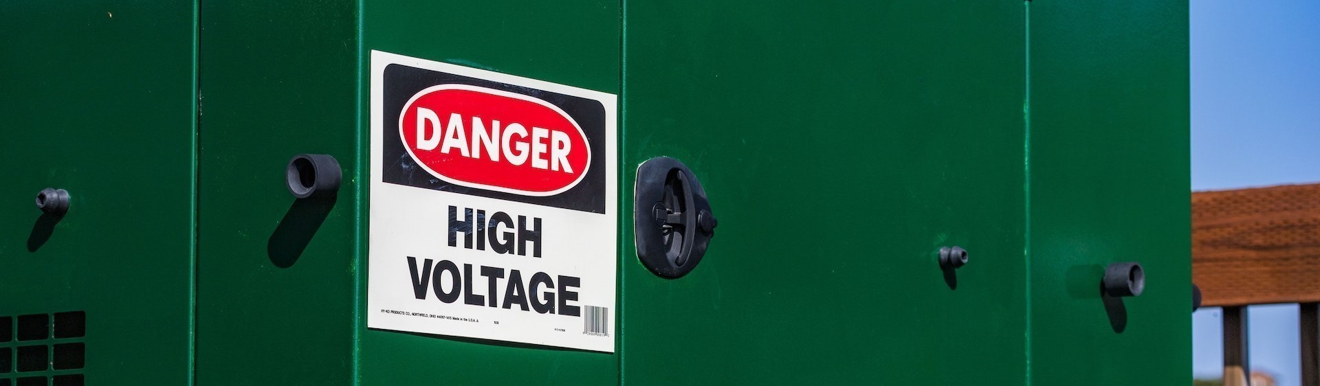 A high voltage danger sign mounted on an electrical equipment box