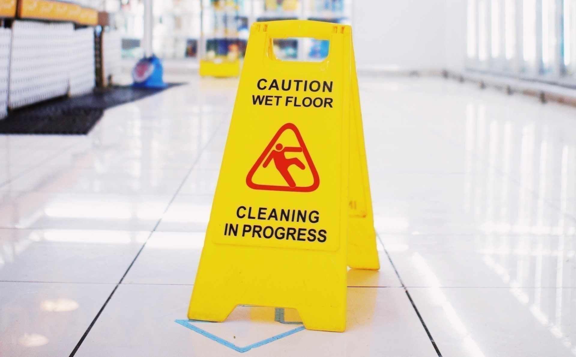 A caution sign warning site visitors about a wet floor